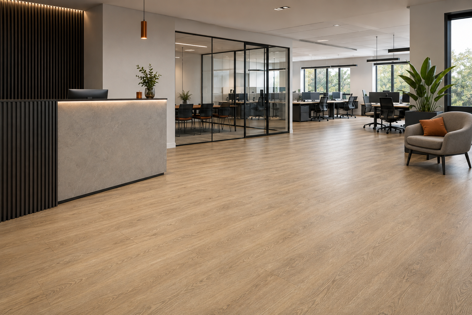 Wood-effect commercial LVT flooring in a modern office reception and workspace